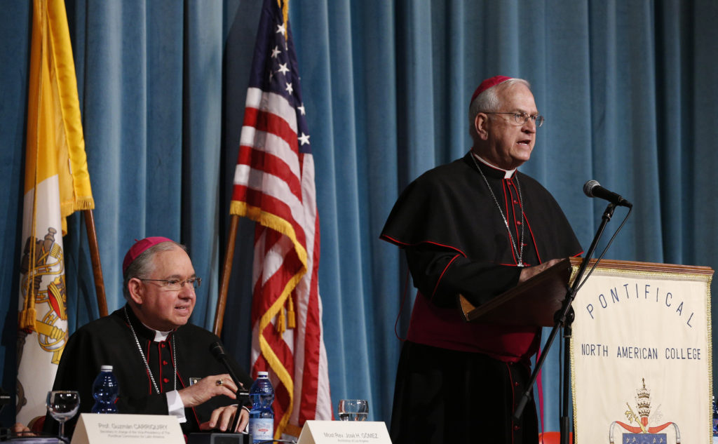 Archbishop Joseph E. Kurtz of Louisville, Ky., president of the U.S. Conference of Catholic Bishops, speaks during during a symposium on Blessed Junipero Serra at the Pontifical North American College in Rome May 2. Also pictured is Archbishop Jose H. Gomez of Los Angeles. The symposium was held before Pope Francis' midday visit to the college to celebrate Mass.  (CNS photo/Paul Haring)