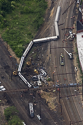 The remains of an Amtrak train that derailed just outside Philadelphia on its way from Washington to New York City are seen from a helicopter May 13. At least seven people died in the May 12 crash and more than 200 were taken to the hospital, some in critical condition. (CNS photo/Jim Lo Scalzo, EPA) 