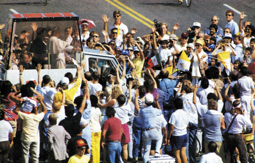Enthusiastic crowds greeted Pope John Paul II’s motorcade during his whirlwind visit to the Diocese of Phoenix Sept. 14, 1987. Today’s local Catholics are equally excited that the diocese’s next Catholic high school, to be built in Avondale, will bear the saint’s name. (File photo/CATHOLIC SUN)