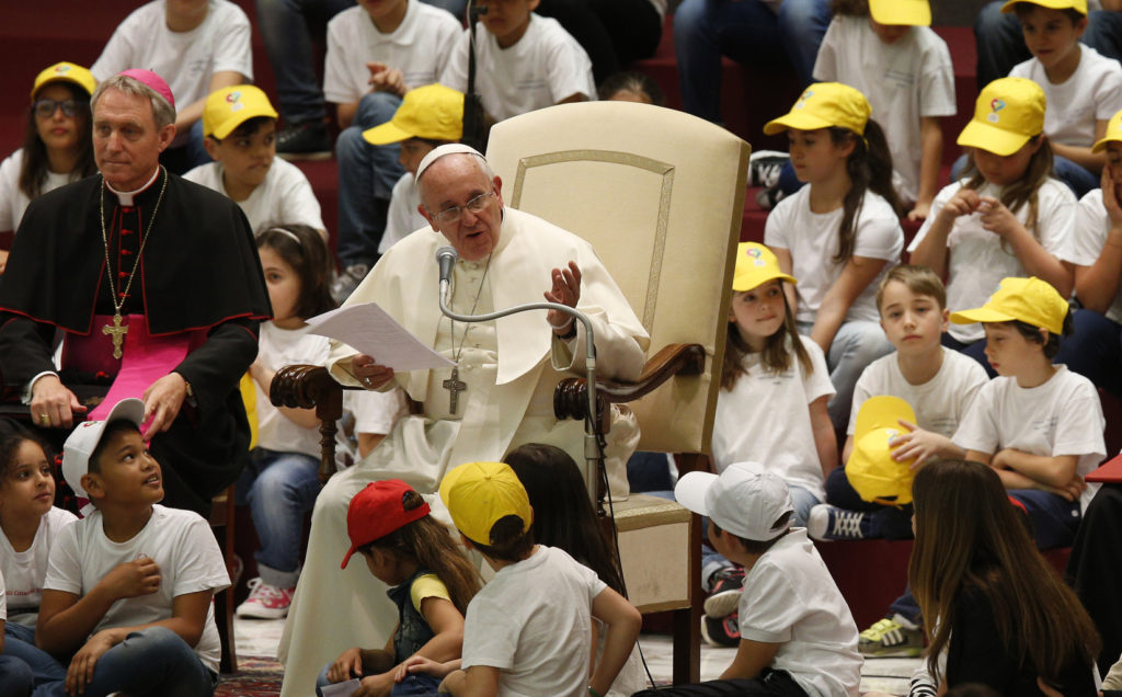 Pope Francis leads an audience with children from the Fabbrica della Pace group in Paul VI hall at the Vatican May 11. In English the group is called the "Peace Factory." The initiative seeks to promote peace, tolerance and inclusion in Italian elementary schools. (CNS photo/Paul Haring) 