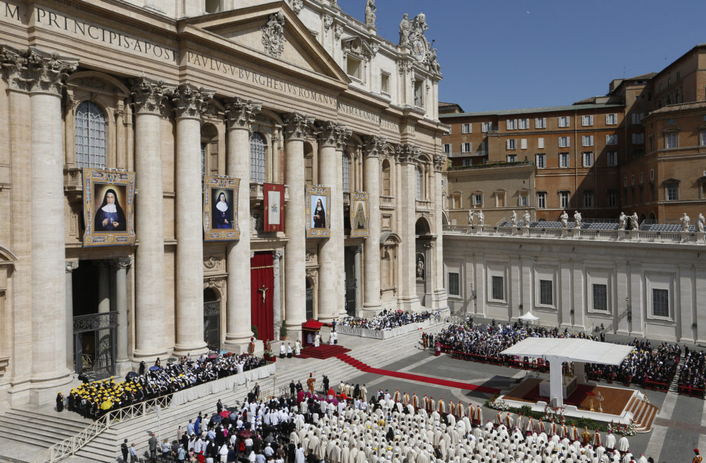 Pope Francis celebrates the canonization Mass for four new saints in St. Peter's Square at the Vatican May 17. The pope canonized four 19th-century nuns. The new saints are: Marie-Alphonsine and Mary of Jesus Crucified, both from historic Palestine; Jeanne Emilie De Villeneuve from France; and Maria Cristina Brando from Italy. (CNS photo/Paul Haring) 