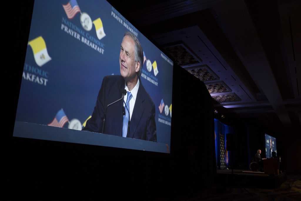Texas Governor Greg Abbott is seen on a big screen during the 11th annual National Catholic Prayer Breakfast May 7 at the Marriott Marquis Hotel in Washington. (CNS photo/Tyler Orsburn) 
