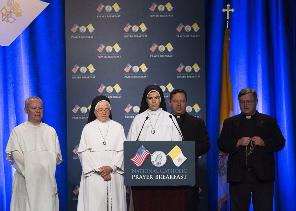 Mary Mother of God Sister Mary Samuel recites a luminous mystery of the rosary during the 11th annual National Catholic Prayer Breakfast May 7 at the Marriott Marquis Hotel in Washington. (CNS photo/Tyler Orsburn) 