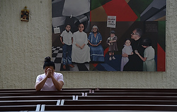 A woman prays in the chapel of Divine Providence Hospital in San Salvador May 21, two days before the beatification of Archbishop Oscar Romero, who was shot by unidentified gunmen as he celebrated Mass in the hospital chapel March 24, 1980. (CNS photo/Lissette Lemus) 