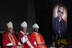 Cardinal Oscar Rodriguez Maradiaga of Tegucigalpa, Honduras, center, speaks May 22 during vigil held on the eve of the beatification of Archbishop Oscar Romero in San Salvador. (CNS photo/Lissette Lemus) 