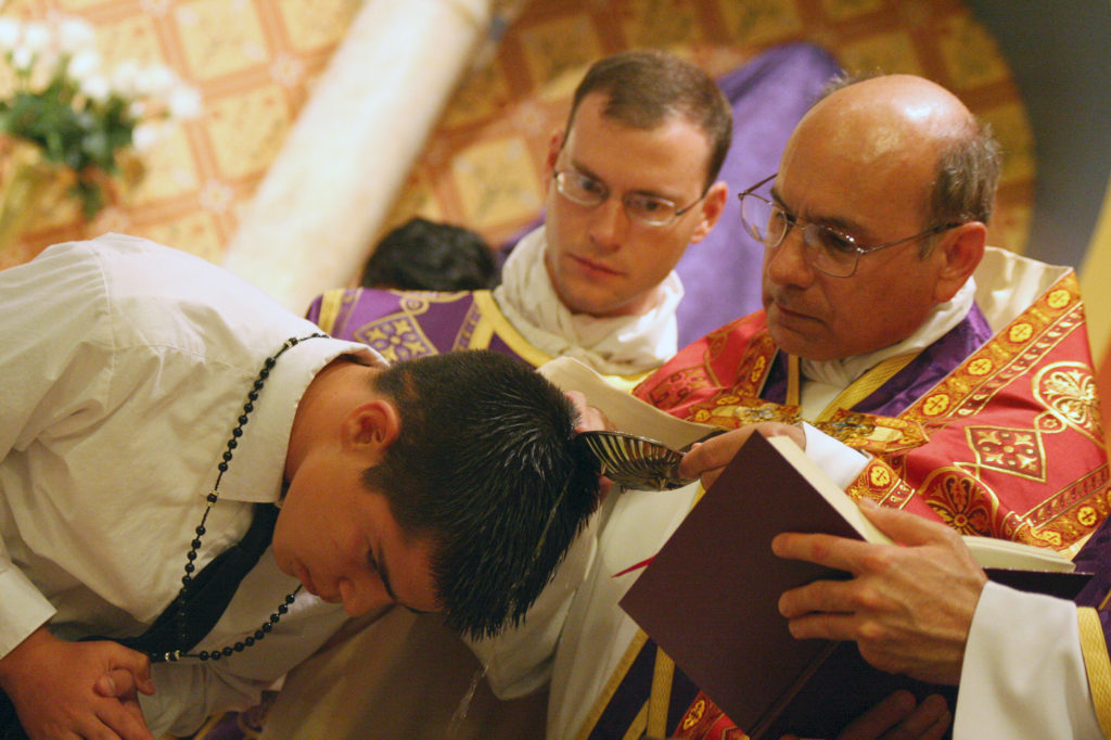 Fr. Joseph Terra, FSSP, and Fr. Kenneth Walker, FSSP, are seen here at an Easter Vigil Mass in April 2012. (J.D. Long-García/CATHOLIC SUN)