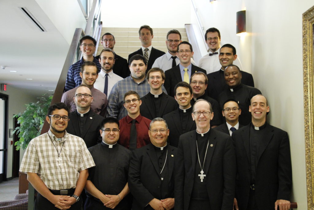 Some Diocese of Phoenix seminarians pose with their bishops and the vocations director June 24 at the Diocesan Pastoral Center. (Ambria Hammel/CATHOLIC SUN)