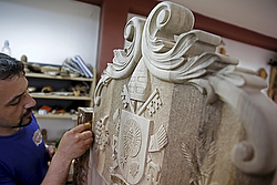 Bosnian woodcarver-sculptor Edin Hajderovac works on a chair for Pope Francis at his workshop in Zavidovici, Bosnia- Herzegovina, May 25. He and his father, Salem Hajderovac, are putting the finishing touches to the chair made from walnut trees, which Pope Francis will use during his visit to Sarajevo. The father and son, both devoted Muslims, initiated the project in the belief that it will reflect the message of peace that the Catholic Church's top leader will bring to Bosnia. (CNS photo/Dado Ruvic, Reuters)