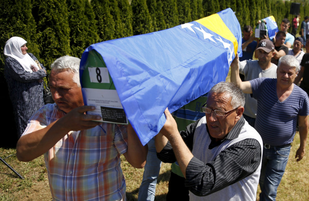 Muslims carry coffins containing the remains of their relatives during a May 12 mass funeral in the town of Bratunac, Bosnia-Herzegovina, for victims of the 1992-95 war. Pope Francis said he will dedicate his June 6 visit to Bosnia-Herzegovina to encouraging a minority Catholic community in the faith, fostering ecumenical and interreligious dialogue, and calling for peace and harmony after the devastations of war. (CNS photo/Dado Ruvic Reuters) 