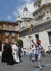 Pope Francis watches as children of Italian prisoners fly kites before their audience with the pope in Paul VI hall at the Vatican May 30. (CNS photo/Paul Haring) 