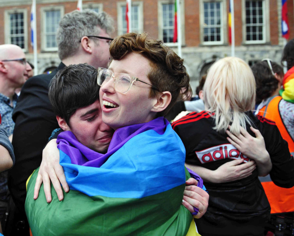 People embrace as the final vote of the referendum on same-sex marriage is announced May 23 in Dublin.  Archbishop Eamon Martin of Armagh, Northern Ireland, president of the Irish bishops' conference, says the church must do more to reach out to gay people. (CNS photo/Aidan Crawley, EPA) 