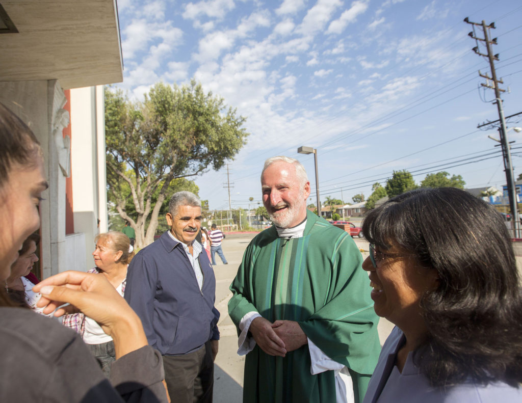 Msgr. David G. O'Connell is pictured speaking with parishioners outside St. Frances X. Cabrini Church in Los Angeles July 19. Pope Francis has named Msgr. O'Connell an auxiliary bishop for the Archdiocese of Los Angeles. Msgr. O'Connell, 61, is a native of County Cork, Ireland, who studied at All Hallows College in Dublin before being ordained a priest of the Los Angeles Archdiocese in 1979. (CNS photo/John Rueda, The Tidings)