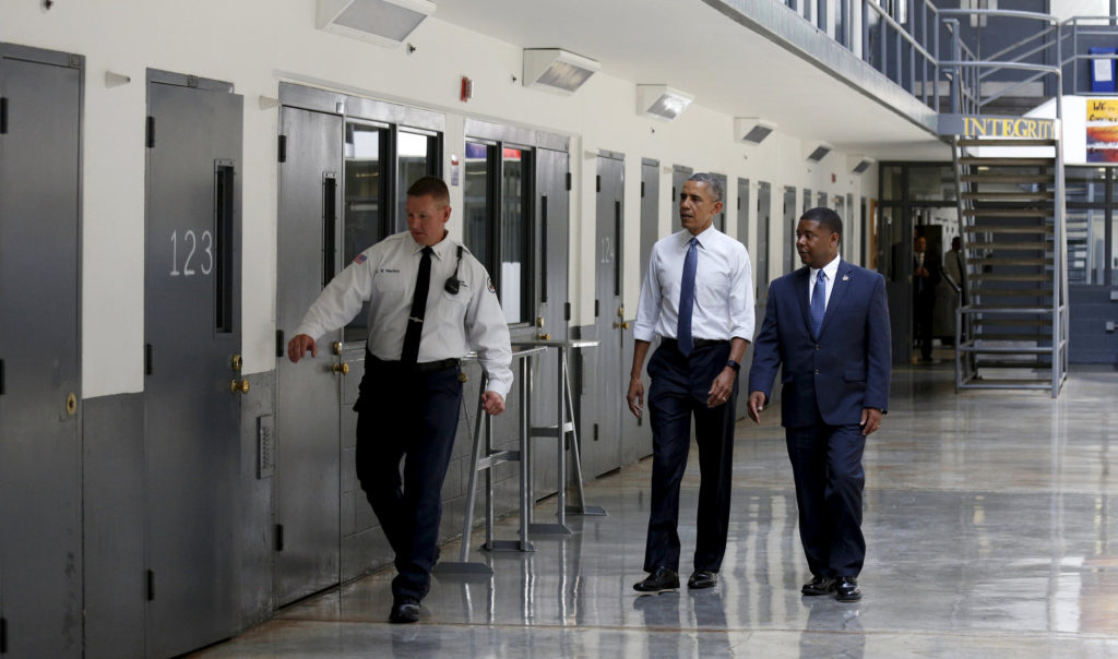 U.S. President Barack Obama visits El Reno Federal Correctional Institution outside Oklahoma City July 16 with  Charles Samuels, bureau of prisons director, right, and a corrections officer. Obama is the first sitting president to visit a federal prison. (CNS photo/Kevin Lamarque, Reuters) 