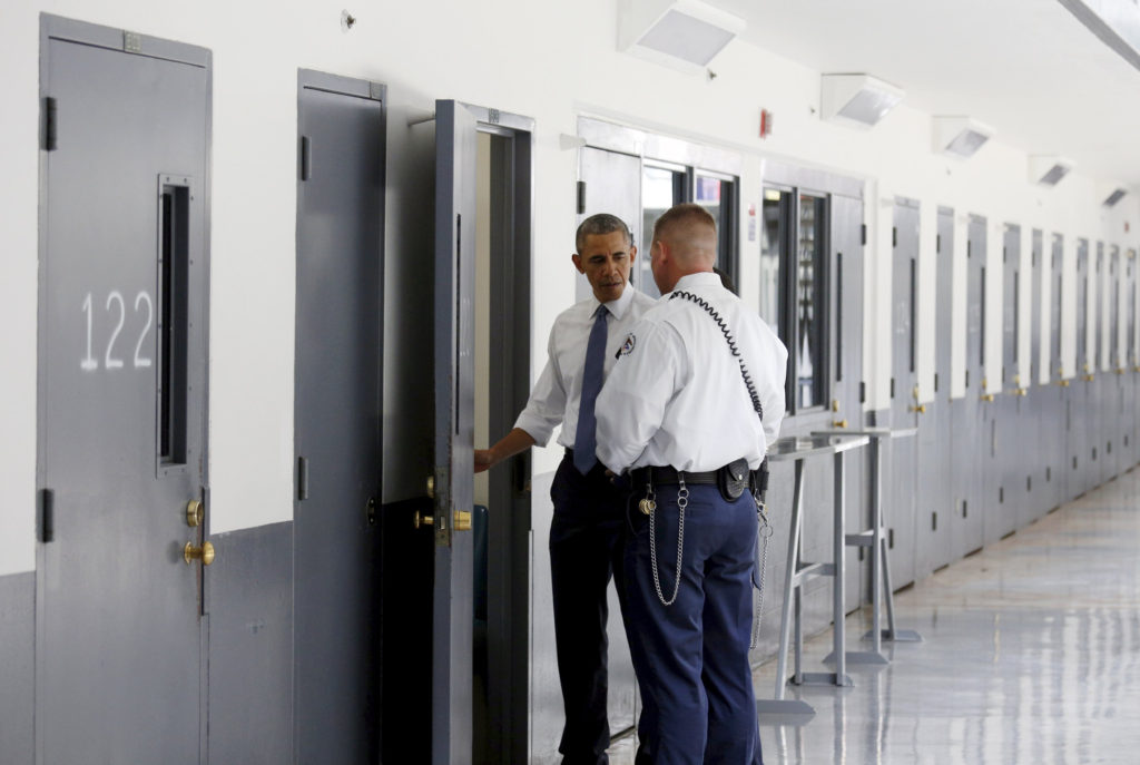 A correctional officer shows U.S. President Barack Obama a cell during a visit to El Reno Federal Correctional Institution outside Oklahoma City July 16. Obama is the first sitting president to visit a federal prison. (CNS photo/Kevin Lamarque, Reuters)