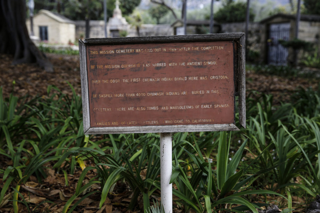 An interpretive sign seen in early May tells visitors that more than 4,000 Chamush Indians are buried in the cemetery at Old Mission Santa Barbara in Santa Barbara, Calif. (CNS photos/Nancy Wiechec)