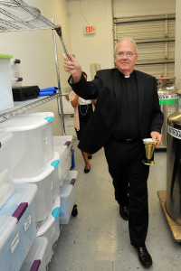 Bishop Robert N. Lynch of St. Petersburg, Fla., blesses the then-new Stemnion facility Sept. 23, 2010 in Clearwater, Fla. The Pittsburgh-based regenerative medicine company had opened the Florida lab near a Catholic hospital where placentas are donated for use in adult stem-cell research. (Tim Boyles/CNS via Catholic Health Association)