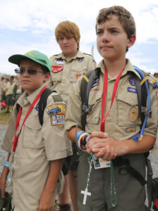 John Jarboe, 13, of Tulsa, Okla., holds his rosary during Mass at the National Boy Scout Jamboree at Summit Bechtel Family National Scout Reserve in Mount Hope, W.Va., July 21, 2013. (Al Drago/CNS  courtesy Boy Scouts of America)