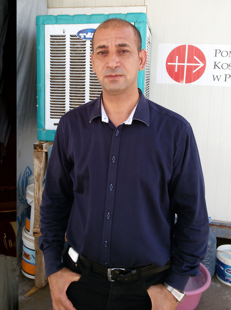 Fr. Bashar Kthea, 39, a Syriac Catholic priest, poses for a photo July 17 in Irbil, Iraq. Initially living in his car after fleeing the town of Qaraqosh, Iraq, last August, when Islamic State forces overran it, he now ministers in a camp for displaced Christians in a Kurdish-controlled part of the country. (CNS photo/Sahar Mansour) 