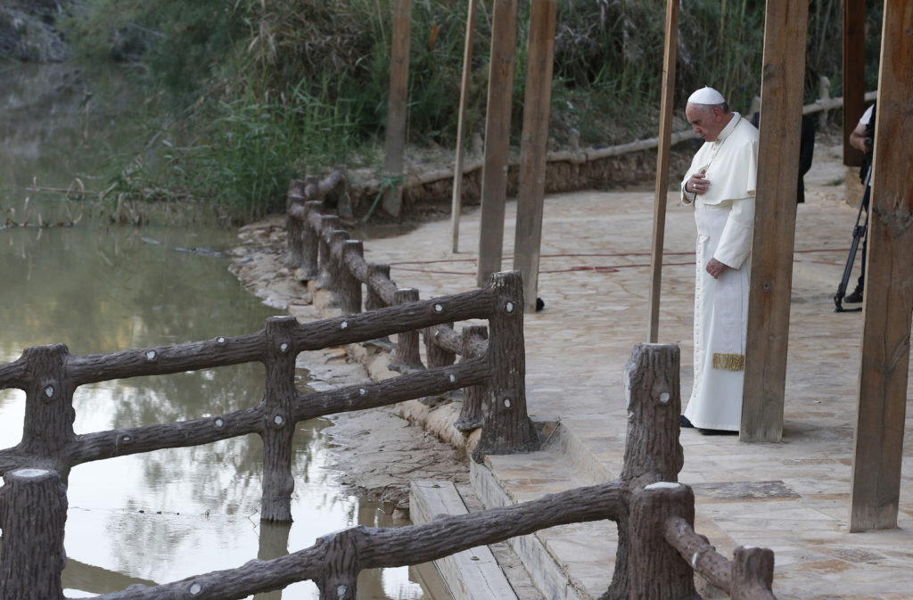 Pope Francis makes the Sign of the Cross in 2014 after praying at  Bethany Beyond the Jordan, which UNESCO just declared a World Heritage site and the location of Jesus' baptism. (CNS photo/Paul Haring) 