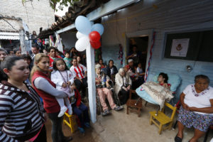 People wait for Pope Francis' arrival to meet with people of Banado Norte, a poor neighborhood in Asuncion, Paraguay, July 12. (CNS photo/Paul Haring) 