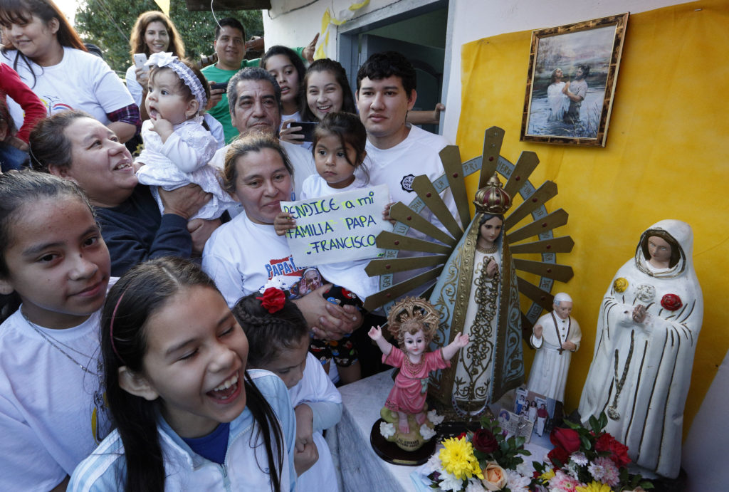 People wait for Pope Francis' arrival to  Banado Norte, a poor neighborhood in Asuncion, Paraguay, July 12. (CNS photo/Paul Haring) 