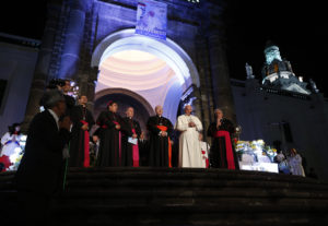 Pope Francis prays as he greets the crowd outside the cathedral in Quito, Ecuador, July 6. The pope is making an eight-day trip to Ecuador, Bolivia and Paraguay. (CNS photo/Paul Haring)