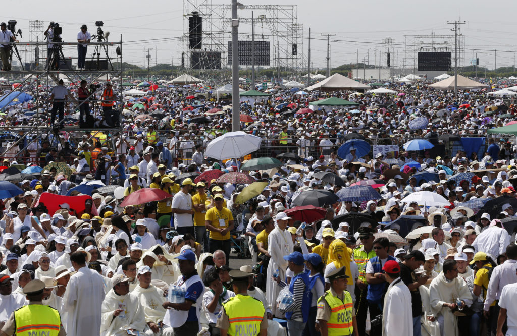 The crowd waits for the start of Pope Francis' Mass in Los Samanes Park in Guayaquil, Ecuador, July 6. The pope is making an eight-day visit to Ecuador, Bolivia and Paraguay. (CNS photo/Paul Haring)