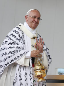 Pope Francis waves as he recognizes someone while using incense during Mass in Bicentennial Park in Quito, Ecuador, July 7. (CNS photo/Paul Haring) 