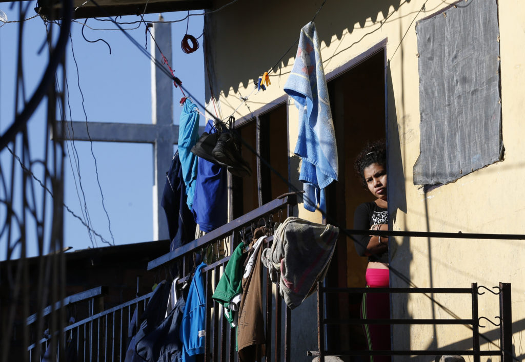 A woman in Palmasola prison in Santa Cruz, Bolivia, awaits Pope Francis' arrival July 10. (CNS photo/Paul Haring)