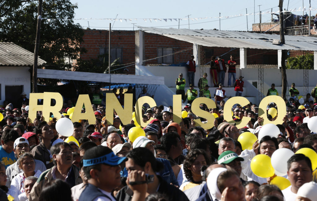 Prisoners and families of inmates in Santa Cruz, Bolivia, await Pope Francis' arrival at Palmasola prison July 10. (CNS photo/Paul Haring) 