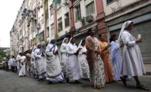 Members of the Missionaries of Charity march toward a church on Good Friday in Kolkata, India, in this 2011 file photo. Pope Benedict XVI singled out Indian women religious to praise them for their positive role in the church in their country. (CNS photo/Rupak De Chowdhuri, Reuters)