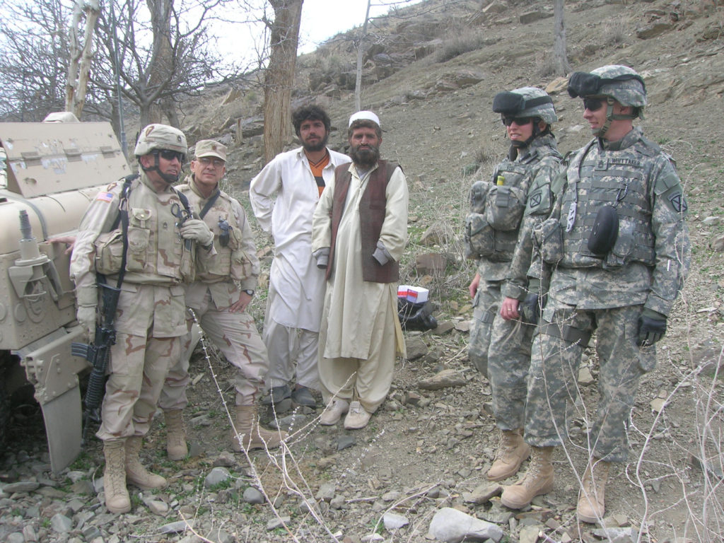 Now-retired Master Sgt. Pablo H. Villescas, far left, is pictured while serving a tour in eastern Afghanistan in 2004. Villescas, the administrator for the Basilica of Our Lady of San Juan del Valle-National Shrine, was in the U.S. Army Reserve for more than 35 years. (CNS photo/courtesy Fr. Amador Garza) 