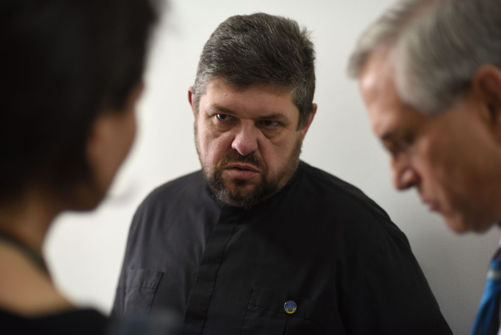 Ukrainian Catholic Fr. Tykhon Kulbaka, who survived pro-Russian separatists' captivity, speaks with a U.S. delegation June 22 in Lviv. The priest recalled his 12 days in captivity and said the emotional captivity that followed was worse than the physical one. (CNS photo/Markian Lyseiko, EPA) 