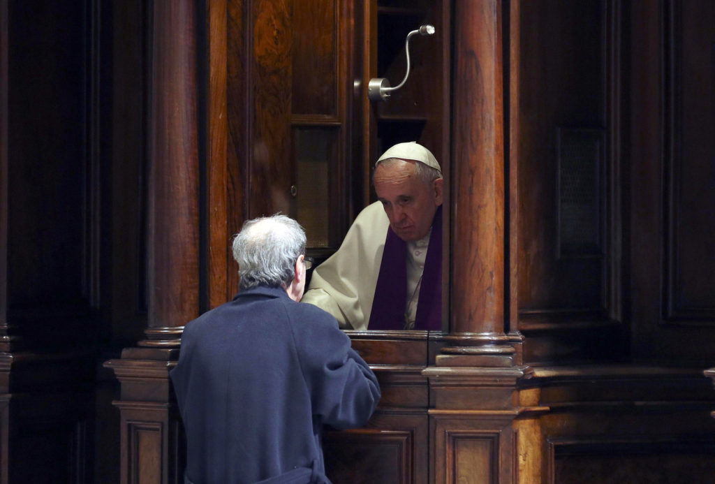 Pope Francis hears confession during a penitential liturgy in early March in St. Peter's Basilica at the Vatican. During his Aug. 2 Angelus, Pope Francis told people not to be afraid or ashamed to go to confession. (CNS photo/Alessandro Bianchi pool via EPA) 