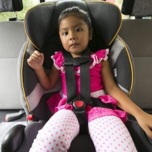 Abigail Garcia, 3, is shown sitting in a front-facing car seat with the straps not properly tightened. Courtesy of The Arizona Republic)