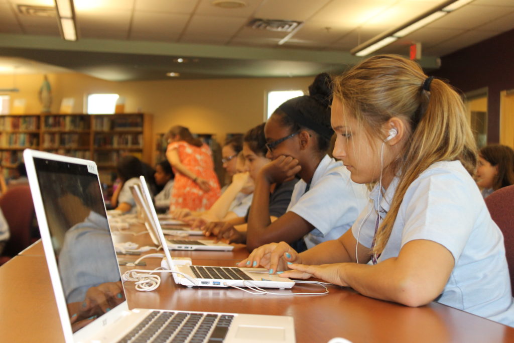 Allison Rutherman, a freshman at Bourgade Catholic High School, along with her classmates, study during tech boot camp. Courtesy of Bryan Burgoz)