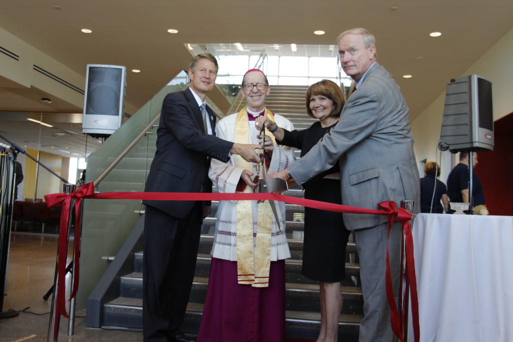 Left to right: Gilbert Mayor John Lewis, Bishop Thomas J. Olmsted, Saint Xavier University President Christine M. Wiseman, JD and Saint Xavier University Chair of the board of trustees John T. Costello cut the ribbon to its Gilbert campus, Aug. 4. (Ambria Hammel/CATHOLIC SUN)