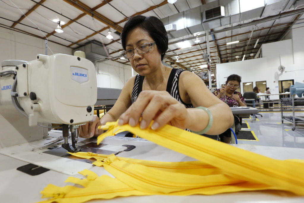 Women work in the sewing area at UTC Aerospace Systems in Phoenix in 2014. The plant manufacturers aircraft emergency evacuation slides. Labor Day, honoring U.S. workers, is observed Sept. 7 this year. (CNS photo/Nancy Wiechec)