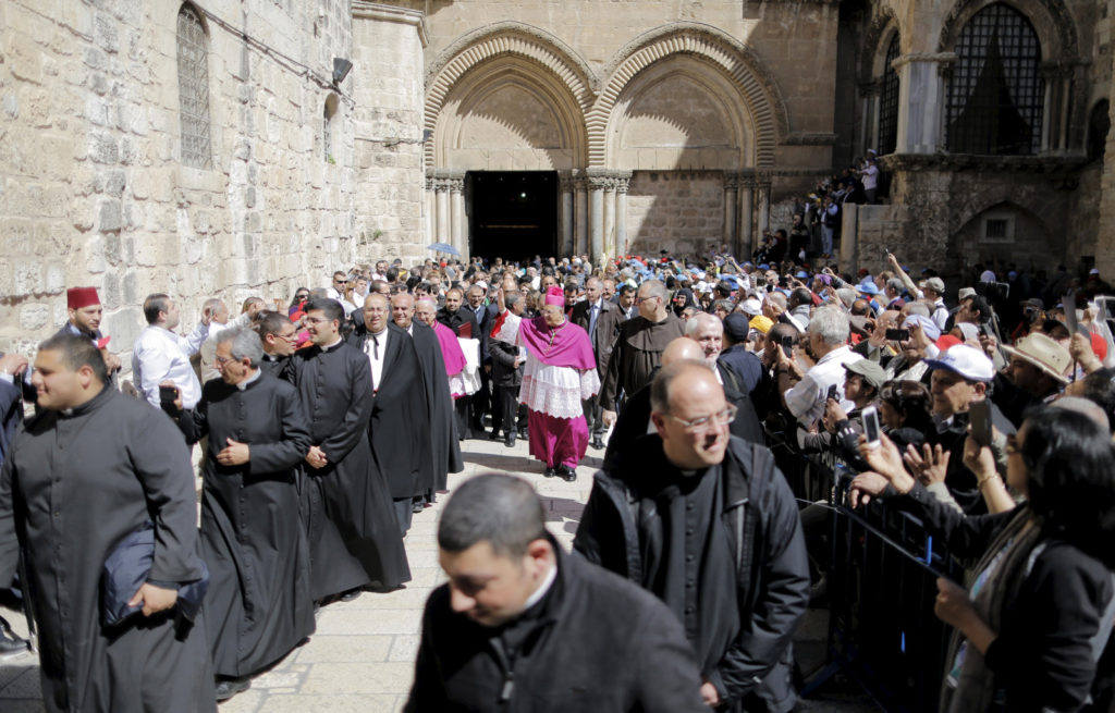 In this file photo, Latin Patriarch Fouad Twal of Jerusalem waves after celebrating Easter Mass at the Church of the Holy Sepulcher in Jerusalem's Old City April 5. Patriarch Twal discussed the struggles faced by many Christians in the Middle East in a session at the World Meeting of Families Sept. 25. (CNS photo/Ammar Awad, Reuters)