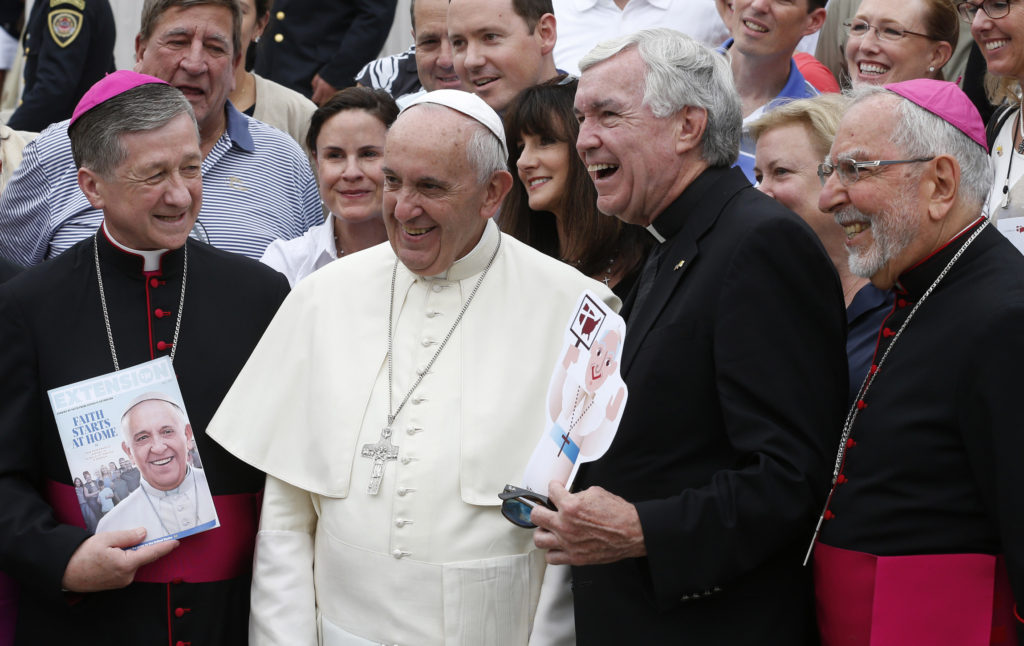 U.S. Archbishop Blase J. Cupich of Chicago, left, and Bishop Gerald F. Kicanas of Tucson, Ariz., right pose with Pope Francis during his general audience in St. Peter's Square at the Vatican Sept. 2. The pope is also flanked by Father Jack Wall, president of Catholic Extension. (CNS photo/Paul Haring) 