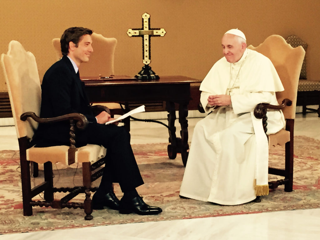 David Muir, anchor of ABC's "World News Tonight," talks with Pope Francis at the Vatican during a virtual town hall meeting with Catholics in Chicago, Los Angeles and McAllen, Texas, Aug. 31. The meeting via satellite link was arranged and hosted by ABC News. (CNS photo/courtesy of ABC News) 