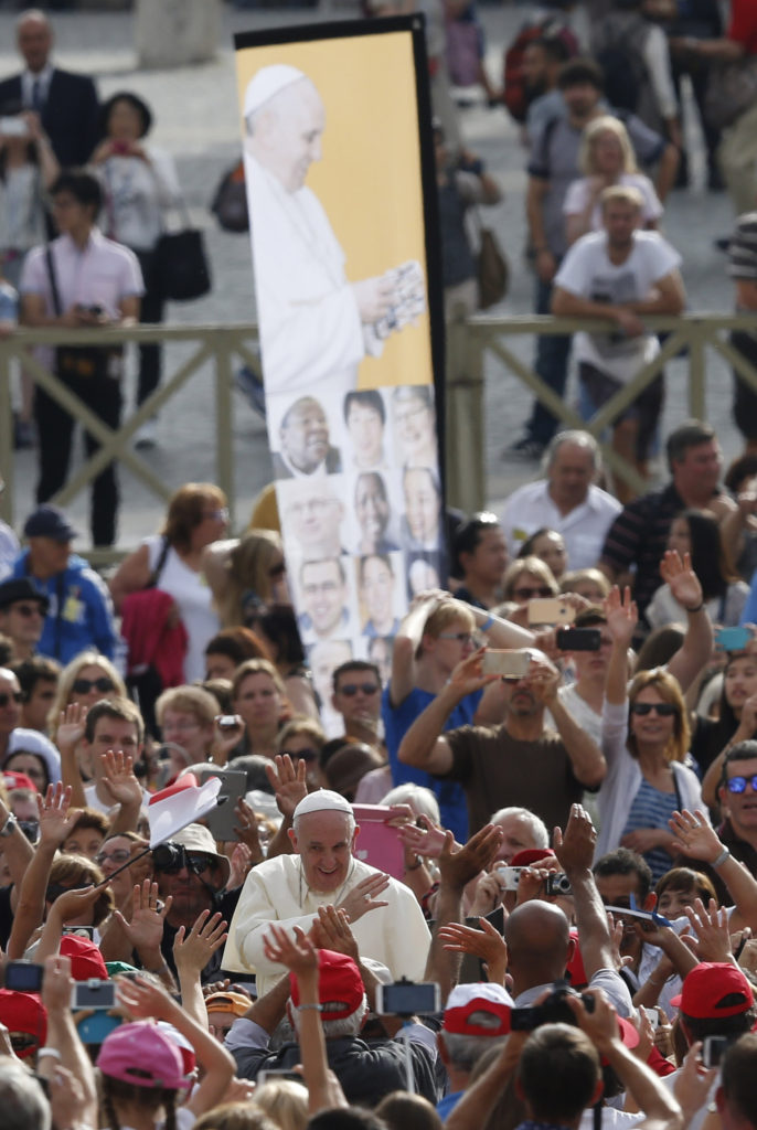 Pope Francis greets the crowd during his general audience in St. Peter's Square at the Vatican Sept. 16. (CNS photo/Paul Haring) 