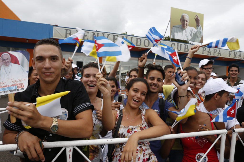 People cheer during the arrival ceremony for Pope Francis at Jose Marti International Airport in Havana Sept. 19. (CNS photo/Paul Haring)