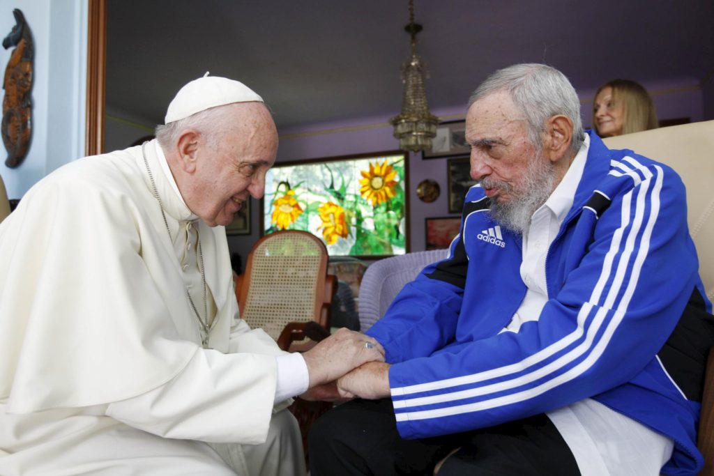 Pope Francis and former Cuban President Fidel Castro hold hands at Castro's residence in Havana Sept. 20. (CNS photo/Alex Castro, AIN handout via Reuters)