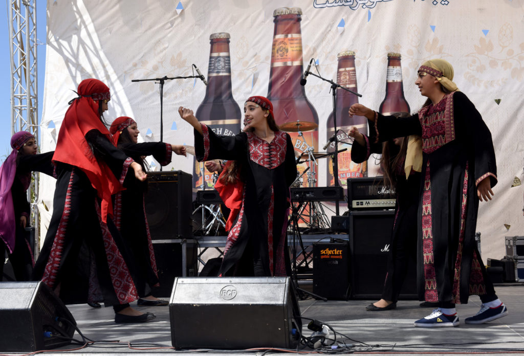 Palestinian students from a Greek Orthodox school perform a traditional dance at the Taybeh Oktoberfest in the West Bank village of Taybeh Sept. 19.  (CNS photo/Debbie Hill) 