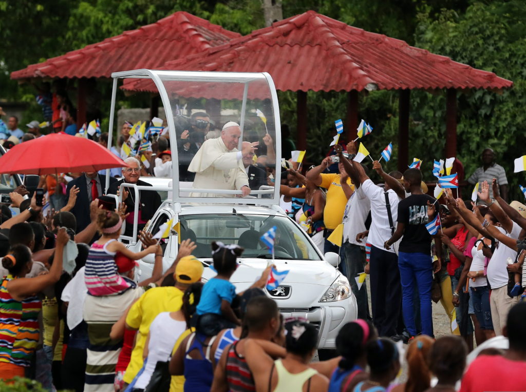 Pope Francis waves from his popemobile in El Cobre, Cuba, Sept. 21, as he makes his way to the shrine of Our Lady of Charity, patroness of Cuba. (CNS photo/Alejandro Ernesto, EPA)