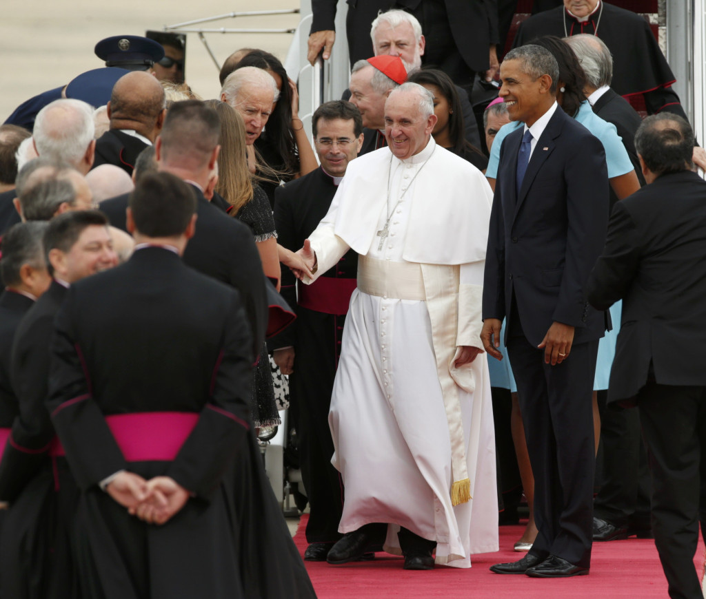 President Barack Obama walks with Pope Francis as the pope greets dignitaries upon his arrival at Joint Base Andrews in Maryland just outside of Washington Sept. 22. (CNS photo/Kevin Lamarque, Reuters)