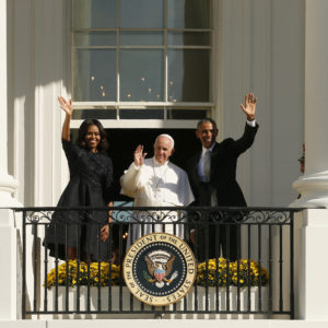 Pope Francis, U.S. President Barack Obama and first lady Michelle wave from the south portico of the White House in Washington Sept. 23. (CNS photo/Paul Haring)