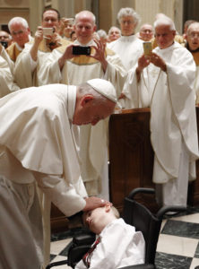 Pope Francis blesses a child in a wheelchair before celebrating Mass with representatives of the Archdiocese of Philadelphia at the Cathedral Basilica of SS. Peter and Paul in Philadelphia Sept. 26. (CNS photo/Paul Haring)