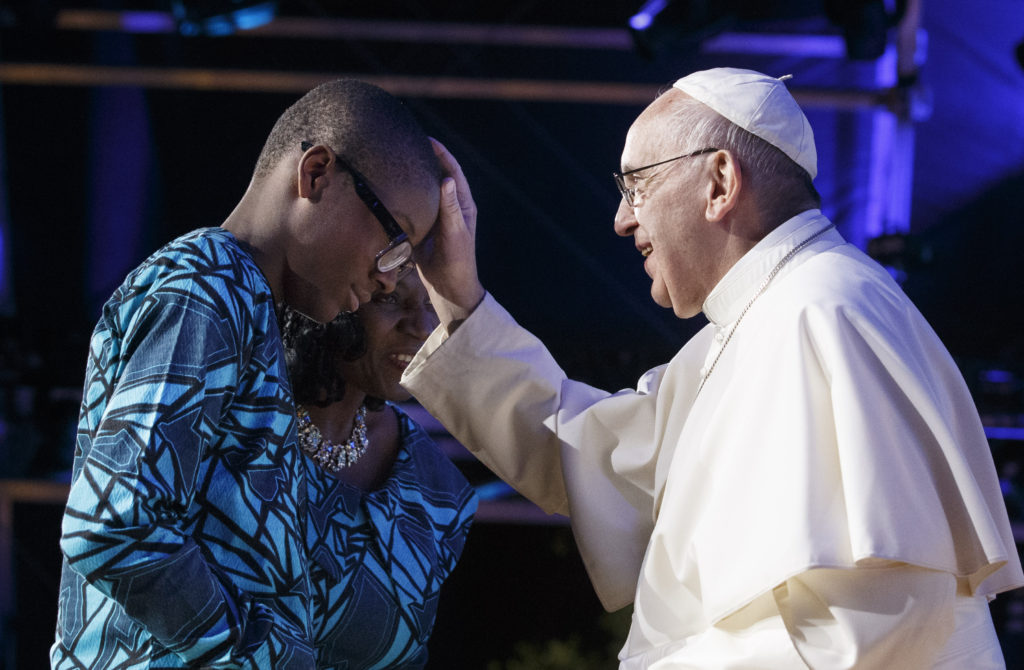 Pope Francis blesses family members who gave a testimony at the Festival of Families during the World Day of Families in Philadelphia Sept. 26. (CNS photo/Paul Haring)